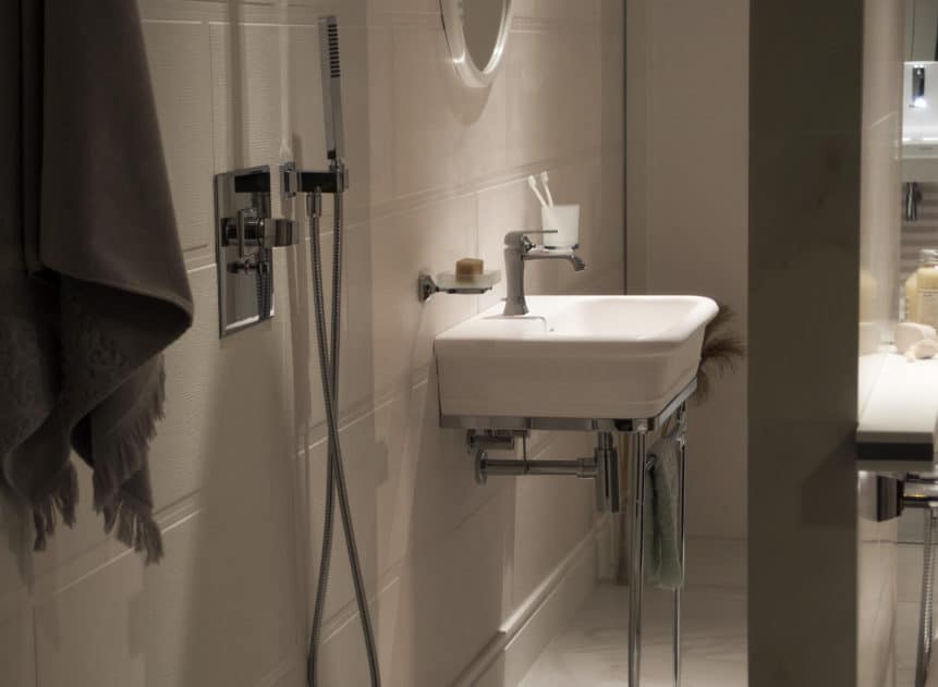 white floating sink in bathroom