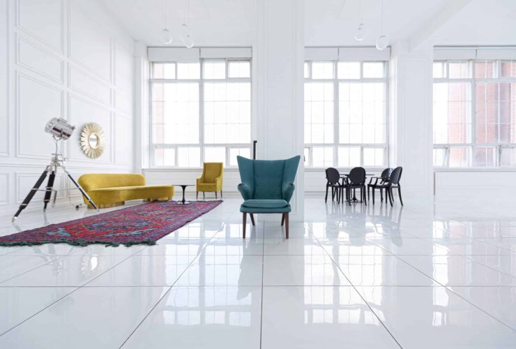 modern fashionable futuristic interior design of a spacious white hall with black and yellow furniture white tiles